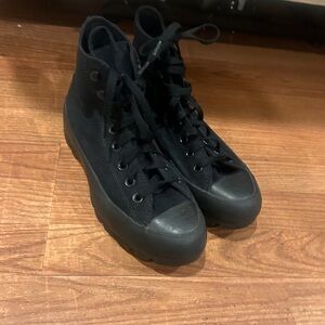 Women’s all black high top Chuck Taylor’s
